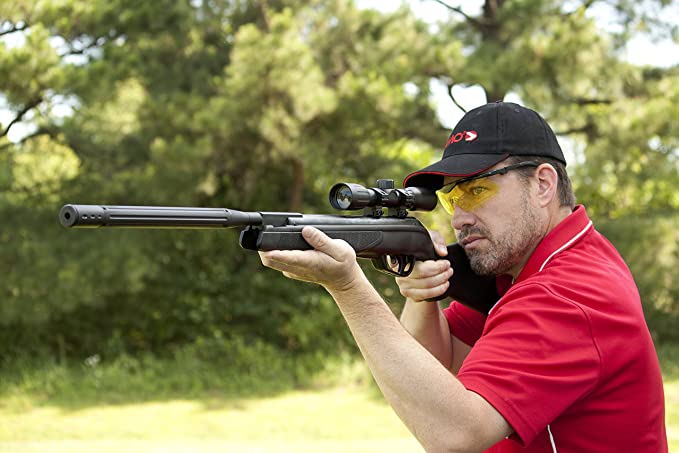 man in red shirt holding up a Hunting Air Rifles
